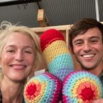 Gillian Anderson Instagram - Wanted to say a huge huge thank you to the darling @tomdaley for knitting this fantastic jumper (and crocheted willy 🌈) for me to wear for our final season of @sexeducation! 🧶🍆 Together we raised just over £12k for @mindcharity, which will be divided amongst 8 local Minds who work with LGBTIQA communities. Thank you for your stellar knitting skills Tom and for coming to visit me on set! Swipe to the end to see the post that started it all (in 2021 🤯)