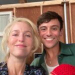 Gillian Anderson Instagram - Wanted to say a huge huge thank you to the darling @tomdaley for knitting this fantastic jumper (and crocheted willy 🌈) for me to wear for our final season of @sexeducation! 🧶🍆 Together we raised just over £12k for @mindcharity, which will be divided amongst 8 local Minds who work with LGBTIQA communities. Thank you for your stellar knitting skills Tom and for coming to visit me on set! Swipe to the end to see the post that started it all (in 2021 🤯)