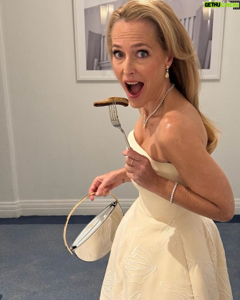 Gillian Anderson Instagram - Sometimes you just need a sausage to go with your yoni dress.