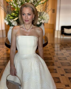 Gillian Anderson Instagram - Sometimes you just need a sausage to go with your yoni dress.