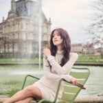 Grace Chan Instagram - The girl in a park in Paris. ⛲️ Before you think how uninspired this caption title is, here me out: The first time I went to Paris was when I was 10 or 11 with my family. It was one of those tour-guided trips —7 countries in 7 days around Europe— and guess what? I LOVED IT. I remember eating escargots for the first time I remember making up songs on the bus with my sister I also remember running through the park, surrounded by French colonial buildings…🤍🩷 And now so many years later, I’m back, but still that girl at heart. What’s your favorite Parisian memory?