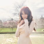 Grace Chan Instagram - The girl in a park in Paris. ⛲️ Before you think how uninspired this caption title is, here me out: The first time I went to Paris was when I was 10 or 11 with my family. It was one of those tour-guided trips —7 countries in 7 days around Europe— and guess what? I LOVED IT. I remember eating escargots for the first time I remember making up songs on the bus with my sister I also remember running through the park, surrounded by French colonial buildings…🤍🩷 And now so many years later, I’m back, but still that girl at heart. What’s your favorite Parisian memory?