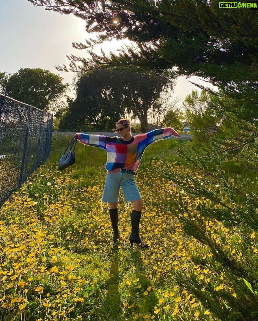 Haley Lu Richardson Instagram - Just me bein silly on a rock and in some flowers wearin a cutie outfit from @thredUP asking you to thrift if you have a shopping addiction like me cause it’s better for the planet and it’s a BLAST peace out babies happy almost earth day weeee!!!!!! #thredUPpartner