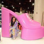 Heidi D'Amelio Instagram - You know it’s a good day when you see the giant pink Ravina shoe! 😍 Back at it in Vegas for @projectshow with @dameliofootwear! …y’all already know I still had to dress up for Mardi Gras while I’m here 💜💛💚