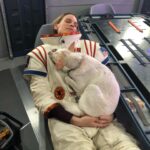 Hilary Swank Instagram - Whether it’s working, hanging out, playing or resting, this is my ♥️ dog, @mamamoon I’m so grateful to have found her on a 200 mile desolate highway in 28°, pregnant and to be able to help her. She is paying me back in spades and then some. You may remember I told you I was claustrophobic in my spacesuit and had to work really hard through it, she was a huge component of that. She just knew, she would struggle to get out of the person’s arms holding her once a take was complete and curl onto my chest and just simply be and breath with me. #WhoRescuedWho? Thanks @deityanimalrescue for helping us find all her sweet babies homes. We 💜 you angel ladies! #AdoptDontShop #MyUnspokenPet #DogsOfInstagram 🐶 🐾 💫💝