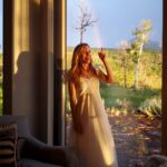 Hilary Swank Instagram - Yesterday was truly magical! 💫 So many wishes came true that have been in the manifestation brewery for 6 months. Can’t wait to share them all with you soon. ALSO, y’all’s outpouring of love, thank you! 🙌🏽 My favorite kind of day is where nothing is planned. And yesterday was a perfect rendition of that! It also included staying in my jammies all day long! Here’s a snippet of my day… and you will see that at the end, JUST after I blew out my candles, a rainbow appeared!! 🤯 Pic number one: Me sitting in a rocker on my porch, with my parrot on my shoulder knitting. What’s that you say? No, I did not turn 74! It was 47 🤣 2. Puppy Snuggles! 🥰 3. Mini-bike riding (don’t worry I only circled so don’t give me a hard time about no helmet!) 4. I planted flowers…yep, still in my jammies! 5. Breakfast in bed food 💝 6. Flowers from @justin_grey_stone and Sam!!! 💐😍 7. Ok, so I did change for dinner. But that was only because it was hair washing day! 🤣 Lots of candles to blow out!! 😅 And with my dear friends 💜 8. 🌈 ❤️🧡💛💚💙💜 🙌🏽 Thanks again for all the love!!!!