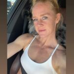 Holly Holm Instagram – Cruisin with my girl, River… aka my neck pillow.