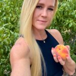 Holly Holm Instagram - Anyone who knows me knows I’ve always wanted my own peach tree. Peaches are by far my favorite fruit IF it’s picked right from a tree. I definitely need to do some research as there were so many that started to grow but stopped. I’m sure I need to do some pruning and give the tree some nutrients etc. However, the peaches that did make it are so super sweet and delicious! I’m excited to see how next year goes but for now I’ll probably be eating 10 a day. 😁