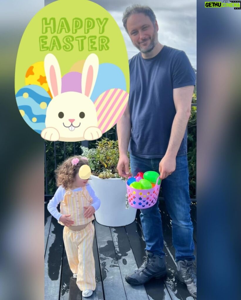 Iliza Shlesinger Instagram - We are Jewish but Sierra’s LA Grandma isn’t which means she gets Easter (and an Easter basket! I’m so jealous 🤍) and we all get Christmas. We filled eggs with Easter “candy” like… raisins and cashews and dried peaches and she had the best time. We did the neighborhood egg hunt too but she didn’t eat the chocolate because Mommy, who never lies, told her it was too spicy. Highlight for me was her holding this little blue bunny so delicately like it was a baby. Nothing will beat last year’s Easter outfit (last slide) but this one came close. 🐣🐰