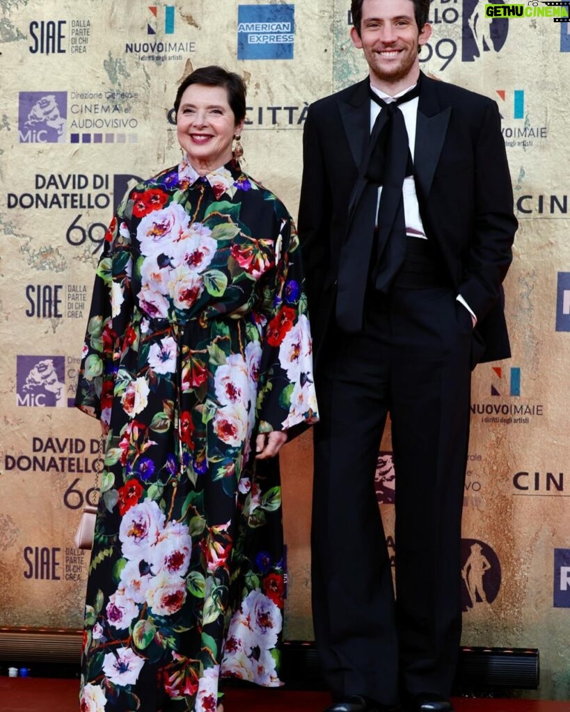 Isabella Rossellini Instagram - Last night at the @premidavid with my favorite sisters in the world Alice and Alba Rorhwacher and Josh O’Connors celebrating our 13 nominations for the film LA CHIMERA. I felt most proud to see the great Gianluca Farinelli director of @cinetecabologna wearing the rose made with the wool of one of my sheep, a rare ancient breed of Lincoln Long Wool @livestockconservancy . I know I am going to write something strange but in my head I see a parallel between artisans who make art films , film preservation and preservation of ancient breed of farm animals . It is all our patrimony . @mamafarm @cinetecabologna #alicerorhwacher #albarorhwacher #joshoconnor photos @rocco_giurato @dolcegabbana