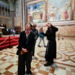 Isabella Rossellini Instagram - In Assisi for @umbriagreenfestival with my show DARWIN’S SMILE. In the photos with my precious collaborators @andy_bright_studio and Guido Torlonia @guitor in the church dedicated to St. Francis protector of animals . Father Giulio gave us the most touching tour of the Church where St. Francis is buried . I have been thinking about all my animals at @mamafarm !