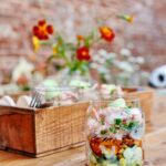 Jamie Oliver Instagram - Some of you lovely lot might know this as a 70s dinner party staple but now it's just as welcome at your picnic !! It is of course.....the might prawn cocktail !!! Layers of succulent prawns with lashings of cocktail sauce, avocado, tomatoes and all topped off with crispy pancetta crumbs, this really is a thing of beauty! Hit the link in my bio for the recipe x x #prawncocktail #weekendvibes #summer