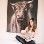 Jana Kramer Instagram - Little Saturday story…..I wrote about this cow painting in @thenextchapterjk about how she spoke to my soul when I was at my lowest and in the middle of quarantine in Vancouver. I shared with the owner of the Airbnb just how much I loved this painting and within months she had surprised me with it. It now hangs in the kitchen area and when we moved into our new house I said to Allan, “sorry that we have this random huge cow hanging in our kitchen area but it’s kind of a long story and it means a lot to me”. He said , “it’s a Scottish highland cow, I grew up with them and love them”. It all made sense in that moment. ♥️#godwinks