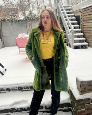 Jemima Kirke Instagram - I fucked Oscar the Grouch and all I got was this lousy coat. He said I was pretty. In a trashy kinda way. 

PS I’ve decided to continue smoking as an act of radical acceptance that looks are ephemeral. I’ll be hanging out at the finish line, cigarette in hand, ready to compare laugh lines. Mine will be deeper than yours. 

(Shirt by me. DM for price. 🫖☕️)
