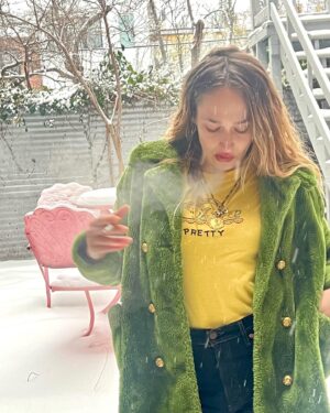 Jemima Kirke Instagram - I fucked Oscar the Grouch and all I got was this lousy coat. He said I was pretty. In a trashy kinda way. 

PS I’ve decided to continue smoking as an act of radical acceptance that looks are ephemeral. I’ll be hanging out at the finish line, cigarette in hand, ready to compare laugh lines. Mine will be deeper than yours. 

(Shirt by me. DM for price. 🫖☕️)