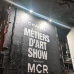 Jenna Coleman Instagram - When Chanel met Manchester… walking through the streets of my youth enroute. Rainwater at my feet. Celebrating the vibrancy, grit, rebellion and chaos that is this city. Joy in my heart, music in the veins. Thank you @chanelofficial @virginieviard ✨ #chanelmétiersdart23 show photo @millie_brady 📸 and her sexy camera ❤️ xx
