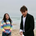 Jenny Han Instagram - IT’S OFFICIALLY SUMMERTIME. The first 3 episodes of #thesummeriturnedpretty are up! (But when we shot this scene, it was late October. SORRY GUYS! 😬🫶🏼)