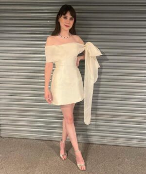 Jenny Walser Instagram - 🎀✨🎀✨🎀✨🎀✨🎀

@officialntas with the @heartstoppertv gang last night! 

Wearing @tranhungofficial @jimmychoo @boodles 

Styled by @rachaelperrystyling 
Assisted by @cristinascales_ @lula_mac 
Hair & Makeup by @nataliestokesmua 

And lastly, bringing the whole look together…
‘Kiosk shutter backdrop’ by Wembley Arena