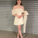 Jenny Walser Instagram - 🎀✨🎀✨🎀✨🎀✨🎀 @officialntas with the @heartstoppertv gang last night! Wearing @tranhungofficial @jimmychoo @boodles Styled by @rachaelperrystyling Assisted by @cristinascales_ @lula_mac Hair & Makeup by @nataliestokesmua And lastly, bringing the whole look together… ‘Kiosk shutter backdrop’ by Wembley Arena