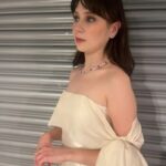 Jenny Walser Instagram - 🎀✨🎀✨🎀✨🎀✨🎀 @officialntas with the @heartstoppertv gang last night! Wearing @tranhungofficial @jimmychoo @boodles Styled by @rachaelperrystyling Assisted by @cristinascales_ @lula_mac Hair & Makeup by @nataliestokesmua And lastly, bringing the whole look together… ‘Kiosk shutter backdrop’ by Wembley Arena