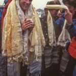 Jimmy Chin Instagram - @conrad_anker receiving a few kata scarves and some serious love and joy from his Sherpa friends in Phortse, Khumbu Valley. It’s hard to go anywhere in the Khumbu with Conrad without having to stop endlessly to receive blessings and gratitude from the locals. @conrad_anker and @jenniloweanker’s work to create and build the @khumbuclimbingcenter has been tremendously satisfying to watch over the years. Their dreams to bring better mountain training and the passion of climbing to the Sherpa community has steadily come to fruition.