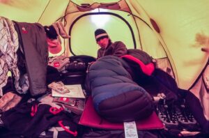 Jimmy Chin Instagram - Tent life with @conrad_anker and @brady_robinson. During the first week of our 2001 expedition to K7, Brady  and I noticed that Conrad always got up before us. We didn't want to seem lazy, so we started getting up earlier and earlier every morning. But each day, Conrad was making coffee or organizing gear by the time we were out of our tents. The night before attempting K7, the three of us agreed to wake up at 3 a.m. Brady and I secretly decided to wake up at 2 a.m. to get ready before Conrad. That morning, Brady and I woke early, quietly gathered our gear, and exited our tent in the dark. As we rushed to load our packs, a headlamp clicked on nearby. I looked over to see Conrad leaning casually against a rock with his pack shouldered and ready to go. I shook my head in awe and disbelief.

@thenorthface