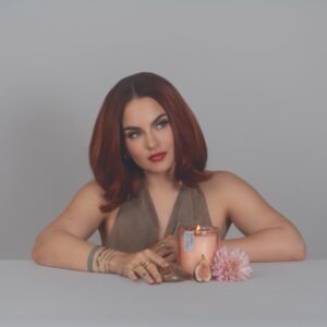 JoJo Instagram - Indulge your senses in my latest limited-edition offering, 𝘗𝘳𝘰𝘴𝘦𝘤𝘤𝘰 𝘗𝘢𝘭𝘰 𝘚𝘢𝘯𝘵𝘰 aka *baby, it’s you*. We combined some of my favorite scents to make a truly sexxyyyy candle. Encapsulated in a coconut soy wax massage oil blend (yes you can use it on your body, baby!) are top notes of sweet amber, dry prosecco, and palo santo. Middle notes are clove, Lilly of the Valley, and a touch of citrus. Grounding base notes evoke a rich mahogany and musk. We are featuring a gorgeous hand- chosen and cleansed sardonyx or apricot agate stone. Sardonyx promotes stability, protection, and happiness. It can attract friends and good fortune and is also known to increase stamina, vigor, and self-control. All important characteristics to employ whether you’re on a self-love journey or in a partnership. Apricot agate is a powerful yet gentle crystal which brings harmony to your energy as well as strength, vitality, and stamina. Our translucent desert rose- colored vessel is reusable and I encourage you to enjoy both the stone and the vessel long after the wax has melted. link in bio ✨🕯️