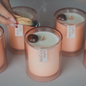 JoJo Instagram - Indulge your senses in my latest limited-edition offering, 𝘗𝘳𝘰𝘴𝘦𝘤𝘤𝘰 𝘗𝘢𝘭𝘰 𝘚𝘢𝘯𝘵𝘰 aka *baby, it’s you*. We combined some of my favorite scents to make a truly sexxyyyy candle. Encapsulated in a coconut soy wax massage oil blend (yes you can use it on your body, baby!) are top notes of sweet amber, dry prosecco, and palo santo. Middle notes are clove, Lilly of the Valley, and a touch of citrus. Grounding base notes evoke a rich mahogany and musk. We are featuring a gorgeous hand- chosen and cleansed sardonyx or apricot agate stone. Sardonyx promotes stability, protection, and happiness. It can attract friends and good fortune and is also known to increase stamina, vigor, and self-control. All important characteristics to employ whether you’re on a self-love journey or in a partnership. Apricot agate is a powerful yet gentle crystal which brings harmony to your energy as well as strength, vitality, and stamina. Our translucent desert rose- colored vessel is reusable and I encourage you to enjoy both the stone and the vessel long after the wax has melted. link in bio ✨🕯️