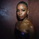 Joy Sunday Instagram - only the latest @laquan_smith for the latest @lancomeofficial girl ✨💜 last night was magical. I’m so lucky to have shared this moment with my family. I’m grateful to all the spirits that made us feel at home. Thank you to Sheika for fixing my makeup every 3 seconds since I kept tearing up 🤣 and shoutout to the only @kamkorderz for making my mama radiant! I know yall are tired of the novels, so I’ll keep it simple, beautiful. thank you. 🌹🤍 #lancome #makeupbysheiks #joysunday