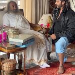 Karanvir Bohra Instagram – Meeting Sri Sri Ravishankar at the #Dharamshala #ArtofLivingAshram was a moment of profound insight. His support fuels my mission to spread yoga’s benefits to everyone. @gurudev #yoga #asanasforraidiance