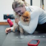 Katrin Tanja Davidsdottir Instagram - Theo loves helping me stretch 🤭🐾 and @gowod_mobilityfirst loves helping me prepare my body for the last week of THE OPEN! ✨ Last one, best one! What do you think we’ll see for 24.3?! @crossfitgames