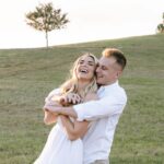 Kelsey Owens Instagram - Future Mr. & Mrs. Strong 🤍 I always pictured my engagement photos all done up and somewhere fancy, but last minute we landed on a field with our dog, champagne, & some pizza☺️ It could not be more us! Photography: @tiffanymaysonetphoto HMUA: @kissandmakeupbysteph