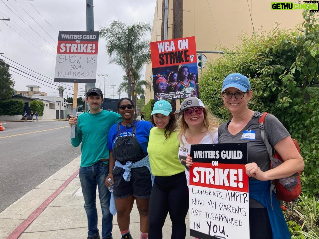 Kirsten Vangsness Instagram - It was especially special today with the @criminalminds energy @charliedewdrop (our proletariat deacon of goodness and cm writer snark) @mzginags (why yes that IS reoccurring guest actor/strike sign writer Agent Garcia as well as prolific 1/2 comedy scribe Gina Garcia Sharp) @chikiguna (winning for signage, garlic bread investigations and CM writers room words of deep mystery ) @jaynearcher (single-handedly writing 76 percent more cats into cm episodes) Take care of the babies. By “babies” I mean hard working writer humans who make the tv and movie sausages that we all eat. #wgastrike