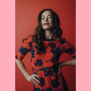 Kristin Kreuk Instagram - It’s a day I don’t celebrate but appreciate that many others do. I hope you are all loving each other and yourselves in ways that help you grow, feel cozy, break your heart (and mend it), make you brave, and allow you to hide when necessary. My cats and I present your feed with pink and red  pictures of us along with poetry by the brilliant Eve Ewing. 

Origin Story(by Eve Ewing from her book “Electric Arches”)
“This is true:
my mother and my father met at the Grevhound bus station in the mid-eighties in Chicago. my mother, all thick glass and afro puff, came west on the train when she was nineteen, lived in a friend's house and cared for her children, played tambourine in a Chaka Khan cover band. my'father, all sleeveless and soft eye, ran away from home when he was seventeen, mimeographed communist newspapers and drew comic books
like this one, for sale. one dollar. my mother bought one.
love is like a comic book. it's fragile and the best we can do is protect it in whatever clumsy ways we can: plastic and cardboard, dark rooms and boxes. in this way, something never meant to last
might find its way to another decade, another home, an attic, a basement, intact.
love is paper.
and if my parents' love was a comic book, it never saw polyvinyl, never felt a backing.
it was curled into a back pocket for a day at the park, lent to a friend, read under covers,
reread hanging upside down over the back of the couch,
memorized, mishandled, worm thin, staples rusted. 
a love like that doesn’t last 
but it has a good ending.” -Eve Ewing

Photo of me by @theportraitsessions