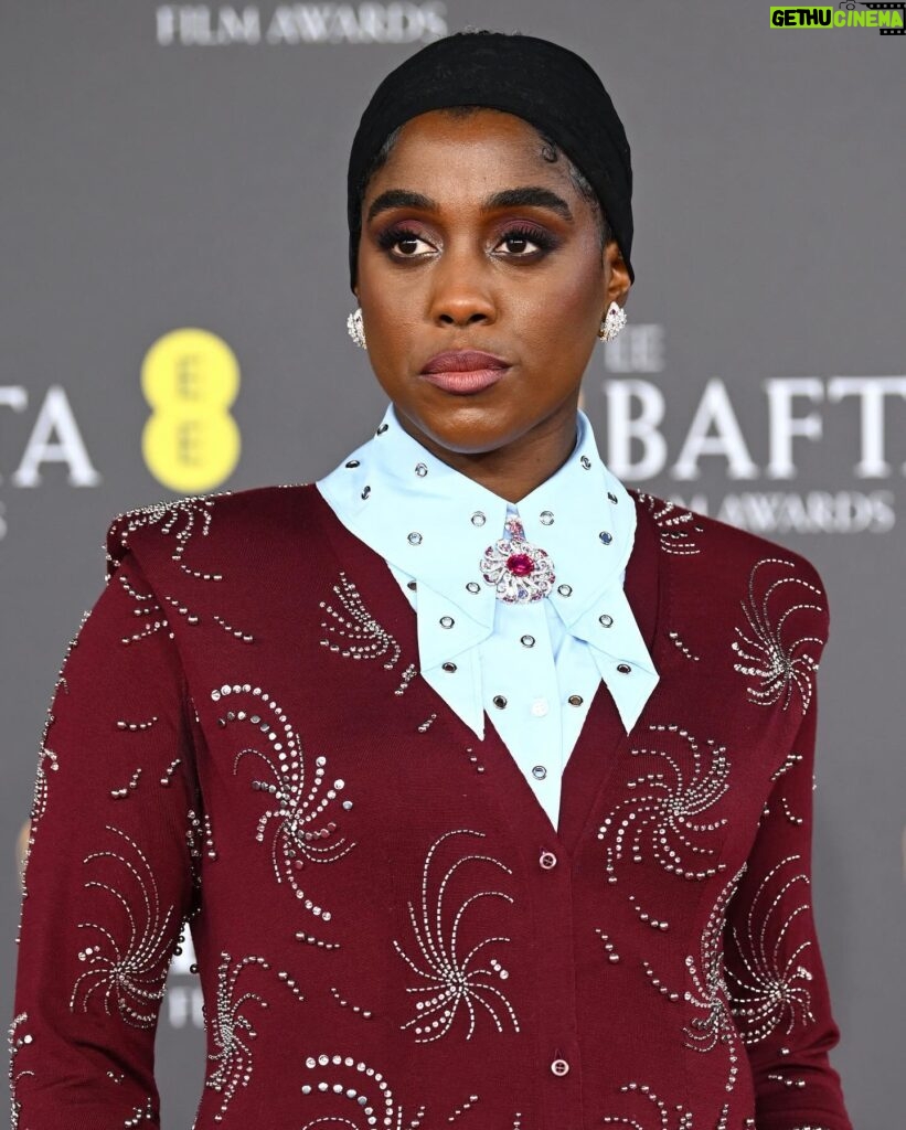 Lashana Lynch Instagram - Thank you @prada for this delicious custom look for @bafta last night. The baby hairs were proud to live in this moment, too! 💁🏾