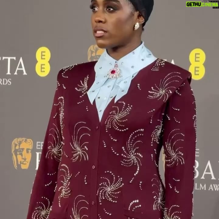 Lashana Lynch Instagram - Thank you @prada for this delicious custom look for @bafta last night. The baby hairs were proud to live in this moment, too! 💁🏾