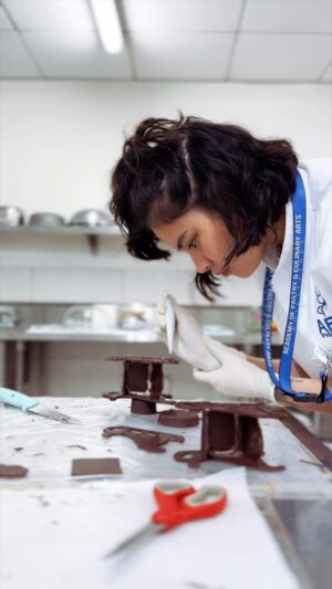 Louise delos Reyes Instagram - Intermediate Modern French

Chef @ajie_segubiense gave us a challenge this week and decided to elevate our modern french cakes, essentially turning them into mini chocolate displays 🍫

Handling chocolate has never been an easy task for me coz, one, my hands are too warm for chocolate (hence the gloves). Second, if you are a clean freak like me you will end up wiping and washing your hands excessively 😂

But believe it or not, tempering chocolate at school relaxes me.

So here's a little video of me doing sleighs and trains. All edible!

@apca_philippines