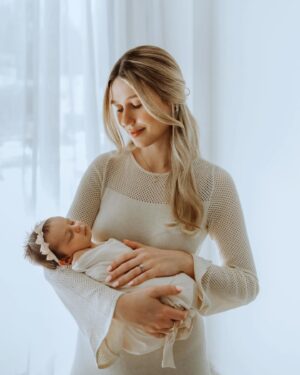 Madisson Hausburg Instagram - Happy Mother’s Day (and happy three months to Sunday)! 🩷 

Three years ago on this holiday, I announced to my family that I was pregnant and we all celebrated my first Mother’s Day together. After Elliot died, Mother’s Day became a very heavy day for me. I never questioned or doubted my title of mom, but motherhood is so much more complicated and confusing without a living child to hold. Today, I am so grateful to celebrate being a mom to both of my children even if it’s not in the way I hoped…with both of my babies earthside. And although my role as mom looks drastically different now than in years past, my love for Elliot and Sunday remains as strong as ever. 

Sending extra love and a big hug to those whose hearts feel heavy today. To those who are missing their mothers, to those who are missing their children, and to those whose arms feel so terribly empty…I see you. You are not alone. 

And as always…I miss you so so very much, my sweet Elliot. Today and everyday. Thank you for making me a mom🪽