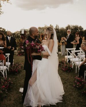 Madisson Hausburg Instagram - 10.21.21 ❤️ My wedding was literally a dream. I was 7 months pregnant with Elliot and I wouldn’t have wanted it any other way. I am so grateful for all the incredible people and vendors who made this day possible.

Event planner: @oroeventco 
Flowers: @tailoredtwig
Venue: @misionlagoestate 
Rentals: @gabroeventservices 
Photography: @paigestellutophoto 
Videography: @onlywavetv 
Accommodations: @hardrocktampa 
Cake: @elisespieces22 
Hair: @cheyanne_hair 
Make up: @melissa_colletteartistry 
Wedding dress: @stefanienaylor 
Bridesmaids dresses: @mumuweddings 
Catering: @cblundys 
Music: @dj_juicy_one & @candi_theviolinist 
Photo booth: @posyexchange 
Neons: @novachrome_design_studio

And a special shout-out to all our family and friends and SK film crew who joined us on this special day! Watch it all begin to unfold tonight on Siesta Key at 9pm💕