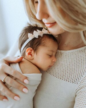 Madisson Hausburg Instagram - Happy Mother’s Day (and happy three months to Sunday)! 🩷 

Three years ago on this holiday, I announced to my family that I was pregnant and we all celebrated my first Mother’s Day together. After Elliot died, Mother’s Day became a very heavy day for me. I never questioned or doubted my title of mom, but motherhood is so much more complicated and confusing without a living child to hold. Today, I am so grateful to celebrate being a mom to both of my children even if it’s not in the way I hoped…with both of my babies earthside. And although my role as mom looks drastically different now than in years past, my love for Elliot and Sunday remains as strong as ever. 

Sending extra love and a big hug to those whose hearts feel heavy today. To those who are missing their mothers, to those who are missing their children, and to those whose arms feel so terribly empty…I see you. You are not alone. 

And as always…I miss you so so very much, my sweet Elliot. Today and everyday. Thank you for making me a mom🪽