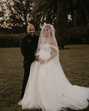 Madisson Hausburg Instagram - 10.21.21 ❤️ My wedding was literally a dream. I was 7 months pregnant with Elliot and I wouldn’t have wanted it any other way. I am so grateful for all the incredible people and vendors who made this day possible.

Event planner: @oroeventco 
Flowers: @tailoredtwig
Venue: @misionlagoestate 
Rentals: @gabroeventservices 
Photography: @paigestellutophoto 
Videography: @onlywavetv 
Accommodations: @hardrocktampa 
Cake: @elisespieces22 
Hair: @cheyanne_hair 
Make up: @melissa_colletteartistry 
Wedding dress: @stefanienaylor 
Bridesmaids dresses: @mumuweddings 
Catering: @cblundys 
Music: @dj_juicy_one & @candi_theviolinist 
Photo booth: @posyexchange 
Neons: @novachrome_design_studio

And a special shout-out to all our family and friends and SK film crew who joined us on this special day! Watch it all begin to unfold tonight on Siesta Key at 9pm💕