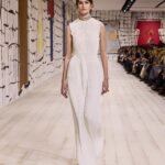 Maria Grazia Chiuri Instagram - With their ability to tame and transform textiles, shape silhouettes and control volumes, pleating and other forms of fabric manipulation play an important role throughout the new #DiorCouture Spring-Summer 2024 collection by @MariaGraziaChiuri. A white crêpe column exemplifies this type of #DiorSavoirFaire with its rows of precise pleats smocked to secure the positioning of the neckline and waist, while another draped dress is ingeniously gathered into a basketweave panel at the front. In red moiré faille, a pleated full skirt is paired with an update on the #DiorBarJacket to reinvent the original and peerless New Look icon.