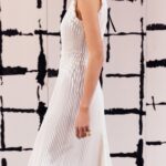 Maria Grazia Chiuri Instagram - With their ability to tame and transform textiles, shape silhouettes and control volumes, pleating and other forms of fabric manipulation play an important role throughout the new #DiorCouture Spring-Summer 2024 collection by @MariaGraziaChiuri. A white crêpe column exemplifies this type of #DiorSavoirFaire with its rows of precise pleats smocked to secure the positioning of the neckline and waist, while another draped dress is ingeniously gathered into a basketweave panel at the front. In red moiré faille, a pleated full skirt is paired with an update on the #DiorBarJacket to reinvent the original and peerless New Look icon.