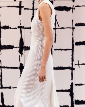 Maria Grazia Chiuri Instagram - With their ability to tame and transform textiles, shape silhouettes and control volumes, pleating and other forms of fabric manipulation play an important role throughout the new #DiorCouture Spring-Summer 2024 collection by @MariaGraziaChiuri. A white crêpe column exemplifies this type of #DiorSavoirFaire with its rows of precise pleats smocked to secure the positioning of the neckline and waist, while another draped dress is ingeniously gathered into a basketweave panel at the front. In red moiré faille, a pleated full skirt is paired with an update on the #DiorBarJacket to reinvent the original and peerless New Look icon.