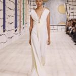 Maria Grazia Chiuri Instagram - With their ability to tame and transform textiles, shape silhouettes and control volumes, pleating and other forms of fabric manipulation play an important role throughout the new #DiorCouture Spring-Summer 2024 collection by @MariaGraziaChiuri. A white crêpe column exemplifies this type of #DiorSavoirFaire with its rows of precise pleats smocked to secure the positioning of the neckline and waist, while another draped dress is ingeniously gathered into a basketweave panel at the front. In red moiré faille, a pleated full skirt is paired with an update on the #DiorBarJacket to reinvent the original and peerless New Look icon.