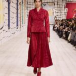 Maria Grazia Chiuri Instagram - With their ability to tame and transform textiles, shape silhouettes and control volumes, pleating and other forms of fabric manipulation play an important role throughout the new #DiorCouture Spring-Summer 2024 collection by @MariaGraziaChiuri. A white crêpe column exemplifies this type of #DiorSavoirFaire with its rows of precise pleats smocked to secure the positioning of the neckline and waist, while another draped dress is ingeniously gathered into a basketweave panel at the front. In red moiré faille, a pleated full skirt is paired with an update on the #DiorBarJacket to reinvent the original and peerless New Look icon.