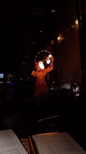 Marianne Williamson Instagram - I came across this picture of a fire dancer who I saw at a restaurant in Atlanta. I was with wonderful friends and volunteers at a modern Latin restaurant and she came to entertain our table. It seems like a poetic expression of the work that has gone on in our campaign over the last year. I love the image of casting light in the midst of darkness, dancing dangerously and creating beautiful patterns that transform the air around the woman as she moves.

I never really knew misogyny before this campaign. I knew it existed, of course, but it had never blocked my way. I had never seen it up close, felt its viciousness or experienced the full breath of its effort to annihilate who a woman is. I hadn’t realized it’s both a conscious and an unconscious phenomenon, diminishing all of us as it throws any woman against the rocks if she dares to refuse to feed the monster. It will take me a long time to understand it all, or to find what medicine for others I might be able to create from having gone through the storm that I have been through. I do know this: the biggest goal of woman-hate in modern society is to make a woman lose faith in herself, to believe there’s something ugly about who she is, to lose her self-confidence, and most importantly, make her stop fire dancing. 

I hope I never do. Within every woman there is a fire dancer, and  at a time like this we desperately need the light.