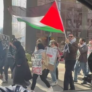 Marjorie Taylor Greene Instagram - I just handed out Trump signs at the Free Palestine march in Columbia, SC, including to my colleague Mike Collins.

My sign waving for Trump hasn’t stopped!