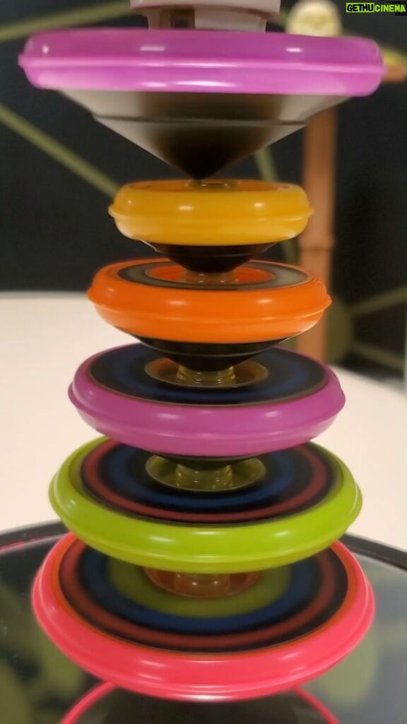 Michael Stevens Instagram - stacking tops #toy #physics #stem #stemtoy #physicstoy #gyroscope #balance #tops #spinning #stacking