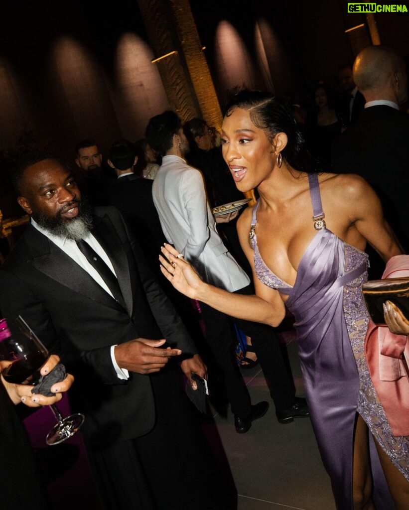 Michaela Jaé Rodriguez Instagram - So…. Naturally, I am a loner, sometimes to a fault. I stay home a lot, simply to shield and guard myself from the Ways of the outside world. In this picture, you see me sitting alone at the Academy Art Gala, amongst a sea of many of my peers, yet I could not muster any will to navigate. Though happy to watch my colleagues dressed to the nines and conversing jovially, I realized my social anxiety, yet again got the best of me. One of my trans sisters noticed me that night. I was so glad to see her, to see her accomplishments, to see her thriving like she’s always wanted to. We sat on the couch for a good while. She asked me “ girl why are you sitting here alone?” And I think my answer basically boiled down to me simply being insecure in a space as a trans woman, when in reality that probably isn’t even the case at all. And if I can remember, she replied with something similar to “girl I know the feeling”. Soon after that beautiful conversation, she saw one of her good friends and made her rounds with them. Continuing to watch alone on the couch, and to ease my anxiety, I treated myself to watching the body language, and the conversations a lot of my peers we’re having. It was very pleasing , seeing them laugh, and seeing them smile. Though, delightfully enamored by all of these interactions, for some reason, I still felt like I was sinking, until a man who I’ve known for some time @mooredarnell pulled me out of the quicksand , along with @pfpicardi. That night had a quick turn around and to the both of them I am thankful. I’m still a work in progress❤️ Ps: I met @lennykravitz that night and almost had a heart attack and he was everything I imagined, a true advocate and allly, I cried like a baby when I went home!